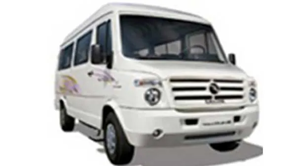 White Tempo Traveller van with tinted windows, front view
